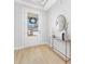 Charming entryway boasts a stylish console table and a front door that fills the space with natural light at 3067 Trace Meadow Ct, York, SC 29745