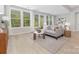 Spacious living room with large windows and light wood floors, offering a seamless blend of comfort and style at 3067 Trace Meadow Ct, York, SC 29745