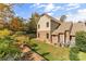 Landscaped backyard with retaining wall and AC units at 119 42Nd Avenue Nw Dr, Hickory, NC 28601