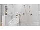 Spa-like bathroom with soaking tub and a marble shower at 119 42Nd Avenue Nw Dr, Hickory, NC 28601