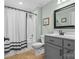 Clean bathroom with gray vanity, shower, and bathtub at 119 42Nd Avenue Nw Dr, Hickory, NC 28601