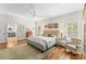 Main bedroom with hardwood floors, ensuite bathroom access, and a ceiling fan at 119 42Nd Avenue Nw Dr, Hickory, NC 28601