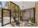 Relaxing screened porch with wooden chairs and views of the backyard at 119 42Nd Avenue Nw Dr, Hickory, NC 28601