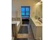 Well-appointed bathroom with double vanity, separate tub, and shower area adjacent to the bedroom at 129 Johnson Manor St, Mooresville, NC 28115