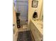 Neutral bathroom features a shower-tub combo, decorative rug, and marble vanity top at 129 Johnson Manor St, Mooresville, NC 28115