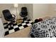 Bedroom with office chairs and black and white accents at 129 Johnson Manor St, Mooresville, NC 28115
