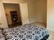 Spacious bedroom with open doorways to closet and bathroom, providing seamless transitions at 129 Johnson Manor St, Mooresville, NC 28115