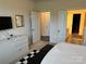 Comfortable bedroom offering plenty of natural light, a dresser, and an open door to the bathroom at 129 Johnson Manor St, Mooresville, NC 28115