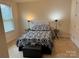 Cozy bedroom featuring black and white bedding and complementing furnishings for a peaceful retreat at 129 Johnson Manor St, Mooresville, NC 28115
