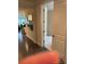 Hallway with hardwood floors leading to a bedroom with carpet at 129 Johnson Manor St, Mooresville, NC 28115