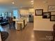 Bright kitchen features an island with bar stools, stainless steel appliances, and open access to the living area at 129 Johnson Manor St, Mooresville, NC 28115