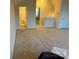 Open loft area featuring neutral carpeting, access to a bathroom, and ample natural light from nearby windows at 129 Johnson Manor St, Mooresville, NC 28115