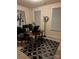 Cozy office features a modern desk and a stylish black and white patterned rug for a professional workspace at 129 Johnson Manor St, Mooresville, NC 28115
