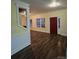 Bright entryway with hardwood floors and red front door at 1703 Polk St, Monroe, NC 28110