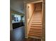 Elegant staircase with wood risers and railing, kitchen view at 1703 Polk St, Monroe, NC 28110