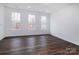 Bright bonus room with hardwood floors and large windows at 2208 Noble Townes Way, Charlotte, NC 28262