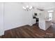 Bright dining room with hardwood floors and a chandelier at 2208 Noble Townes Way, Charlotte, NC 28262