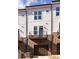 Rear view of townhome with balcony and garage at 2208 Noble Townes Way, Charlotte, NC 28262