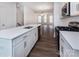 Modern kitchen with white cabinets, quartz countertops, and stainless steel appliances at 2208 Noble Townes Way, Charlotte, NC 28262