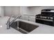 Modern kitchen sink with a stainless steel basin and chrome faucet at 2208 Noble Townes Way, Charlotte, NC 28262