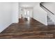 Spacious living room with hardwood floors and staircase at 2208 Noble Townes Way, Charlotte, NC 28262