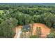 Aerial view of the home surrounded by mature trees, emphasizing its secluded setting and natural beauty at 315 Bonaventure Dr, Salisbury, NC 28147