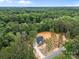 High aerial view showing the home site with mature trees, neighborhood, and paved driveway at 315 Bonaventure Dr, Salisbury, NC 28147