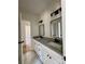 The modern bathroom boasts double sinks, granite countertops, sleek hardware, and marble floors at 315 Bonaventure Dr, Salisbury, NC 28147