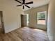 A bright bedroom features new floors, a modern ceiling fan, and windows that provide ample natural light at 315 Bonaventure Dr, Salisbury, NC 28147