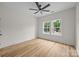 Bedroom with wood-look floors, ceiling fan, and sunny double windows at 315 Bonaventure Dr, Salisbury, NC 28147