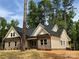 Striking view of a brick home, surrounded by a verdant landscape at 315 Bonaventure Dr, Salisbury, NC 28147