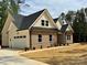 Beautiful brick home featuring a two-car garage, complemented by manicured landscaping at 315 Bonaventure Dr, Salisbury, NC 28147