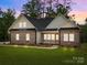 Charming brick home featuring a well-manicured lawn and inviting front porch at 315 Bonaventure Dr, Salisbury, NC 28147