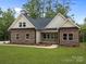 Charming brick home featuring a well-manicured lawn and inviting front porch at 315 Bonaventure Dr, Salisbury, NC 28147