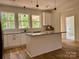 Kitchen featuring an island with granite countertops, stainless appliances and modern pendant lighting at 315 Bonaventure Dr, Salisbury, NC 28147