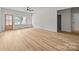 Spacious, light-filled living room with large windows and a wood-look floor, showcasing the inviting entryway at 315 Bonaventure Dr, Salisbury, NC 28147
