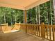 A clear view of the wooden porch and railing with lovely wooded scenery at 315 Bonaventure Dr, Salisbury, NC 28147