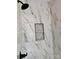 The shower is lined with marble tile and features a niche and modern fixtures for a luxurious feel at 315 Bonaventure Dr, Salisbury, NC 28147