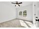 Inviting bedroom with neutral carpet, ceiling fan, and double windows offering an airy feel at 606 Meadow Ave, Spencer, NC 28159