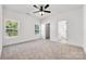 Spacious bedroom with ample natural light, and an adjacent bathroom at 606 Meadow Ave, Spencer, NC 28159
