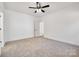 Well-lit bedroom with plush carpet and neutral tones at 606 Meadow Ave, Spencer, NC 28159
