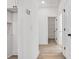 Hallway featuring doors to various rooms and light hardwood flooring at 606 Meadow Ave, Spencer, NC 28159