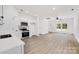 Spacious open-concept kitchen with stainless steel appliances and an adjacent living area at 606 Meadow Ave, Spencer, NC 28159