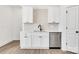 Kitchen featuring white cabinets, stainless steel dishwasher, and a stylish black faucet at 606 Meadow Ave, Spencer, NC 28159