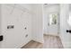 Functional laundry room with shelving, utility hookups, and convenient access to the outdoors at 606 Meadow Ave, Spencer, NC 28159