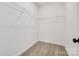 Walk-in closet with ample shelving for optimal storage solutions at 606 Meadow Ave, Spencer, NC 28159