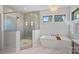 Elegant bathroom with a large walk-in shower and a freestanding tub at 705 Mcalway Rd, Charlotte, NC 28211