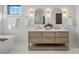 Double vanity bathroom with marble countertop and modern lighting at 705 Mcalway Rd, Charlotte, NC 28211