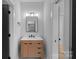 Modern bathroom with a light wood vanity and a large mirror at 705 Mcalway Rd, Charlotte, NC 28211