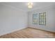 Bright bedroom featuring hardwood floors and large windows at 705 Mcalway Rd, Charlotte, NC 28211